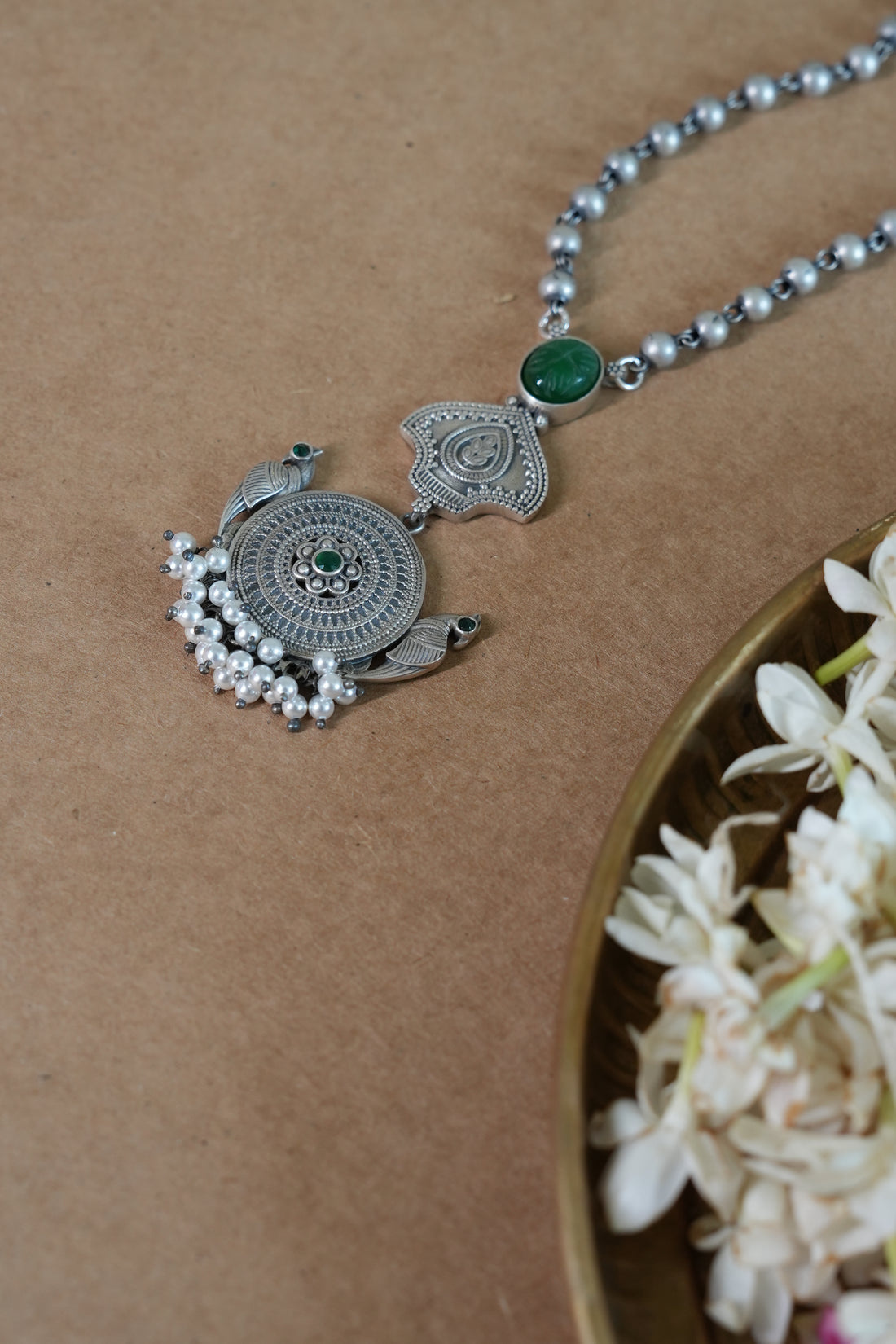 Temple-Inspired Oxidised Silver Pendant with Carved Green Stone