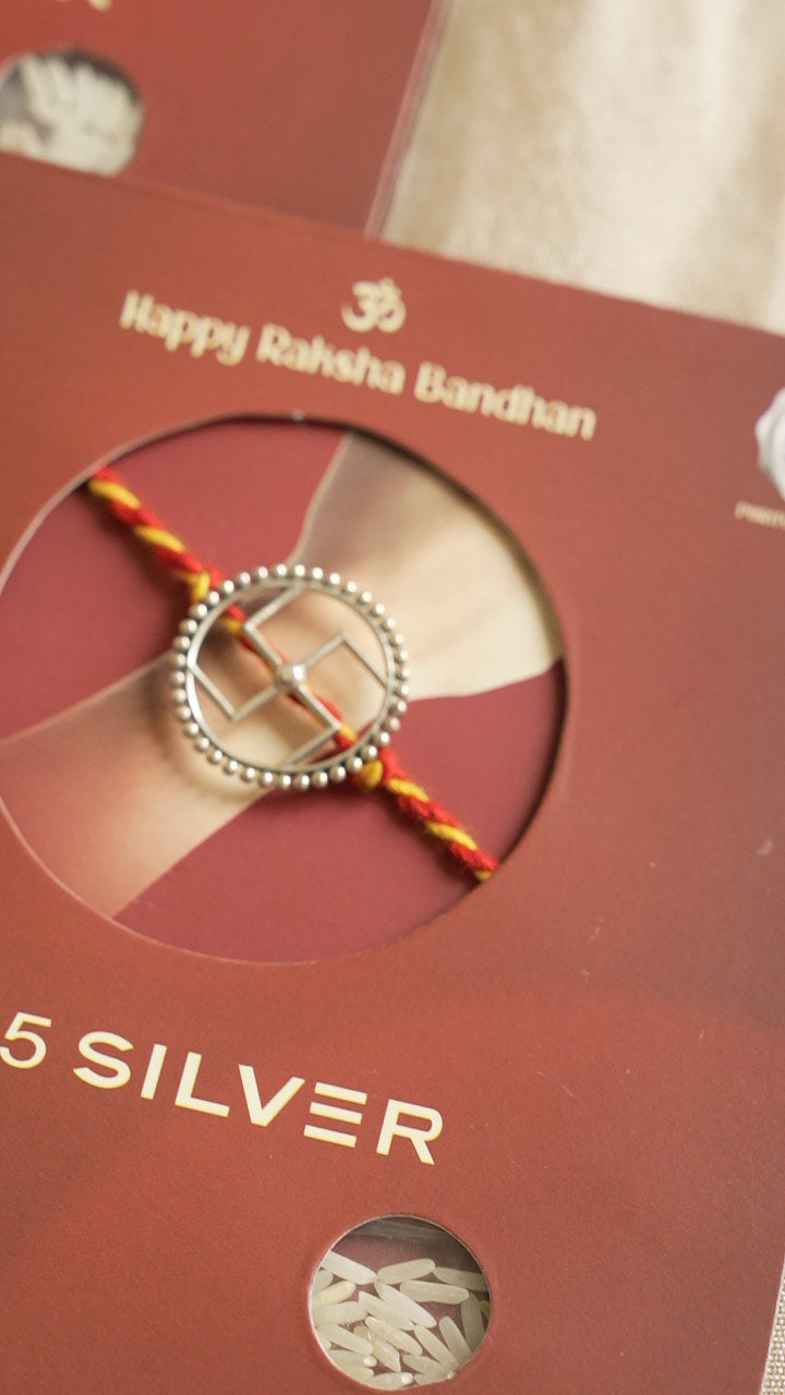 silver swastik rakhi