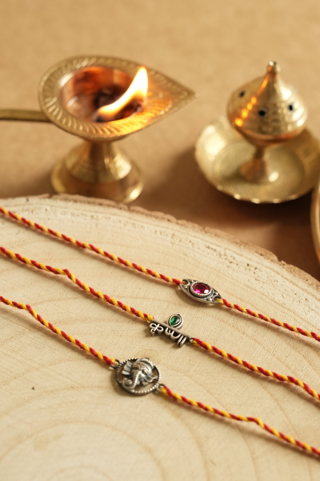 silver rakhi set 